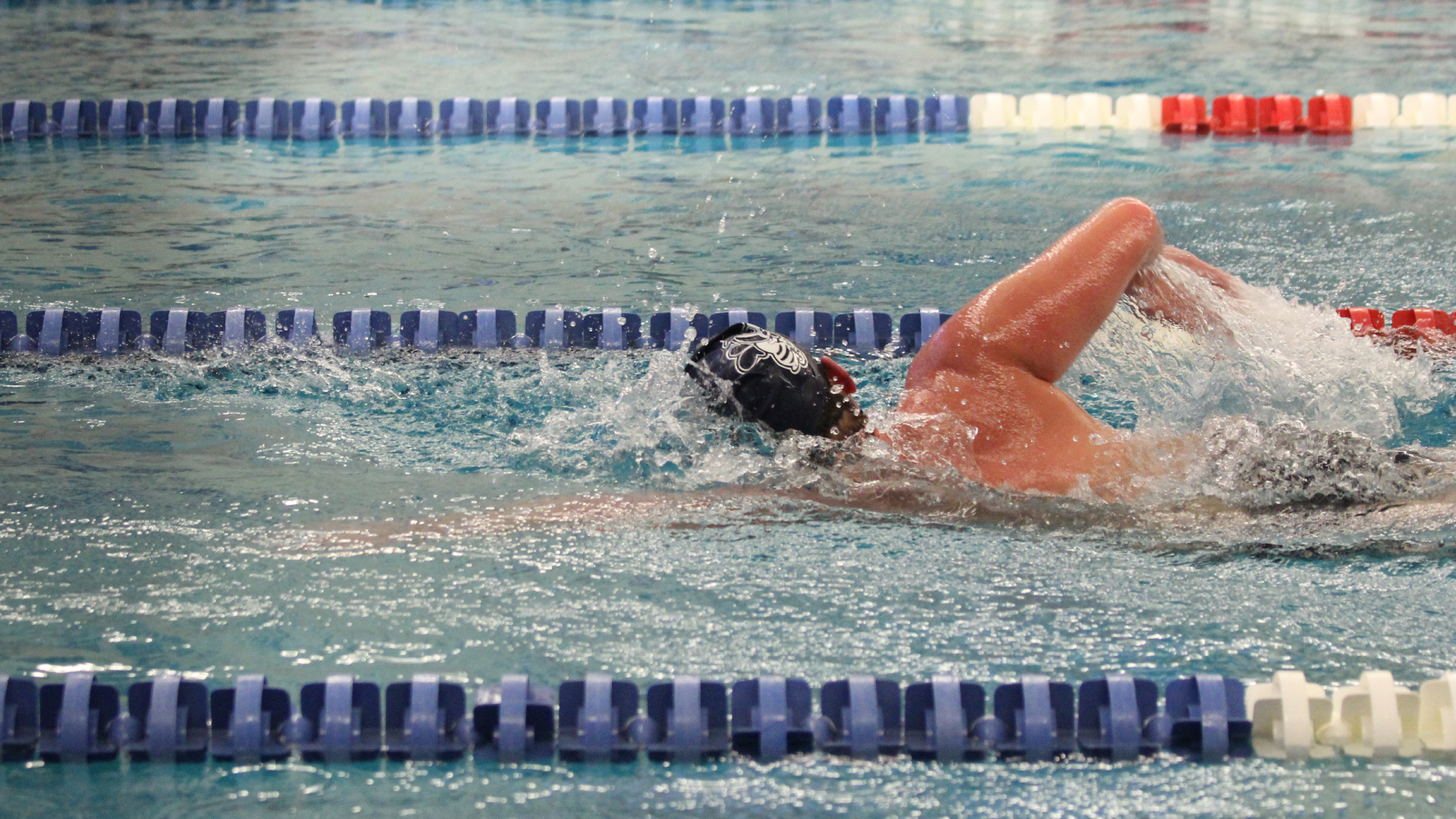 Men and women swim past Midland